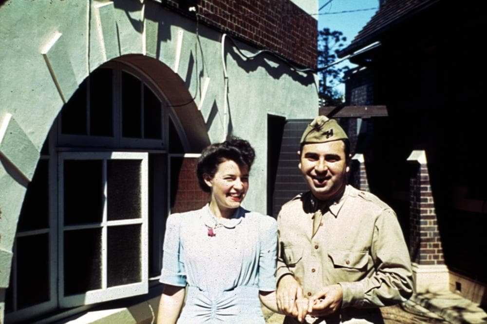 Somerville — StateLibQld 2 319369 Teletype operator, Olga Honey, with assistant signal officer American Lieutenant Mark Muller outside Somerville House in Brisbane, 1942