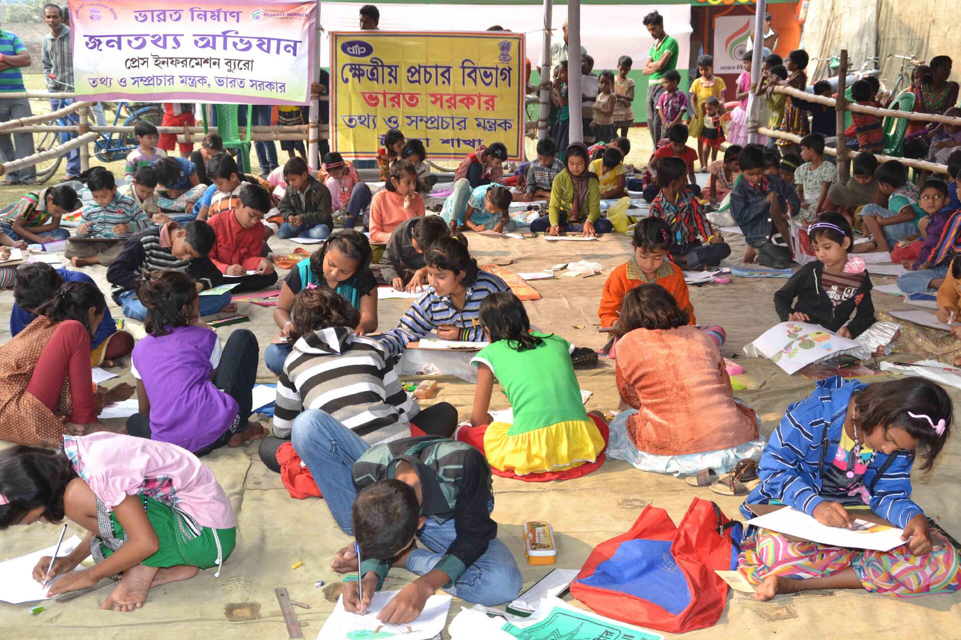 Murshidabad — Children taking part in a sit & draw competition, organised by DFP, as part of the Bharat Nirman Public Information Campaign, at Murshidabad, West Bengal on December 22, 2013