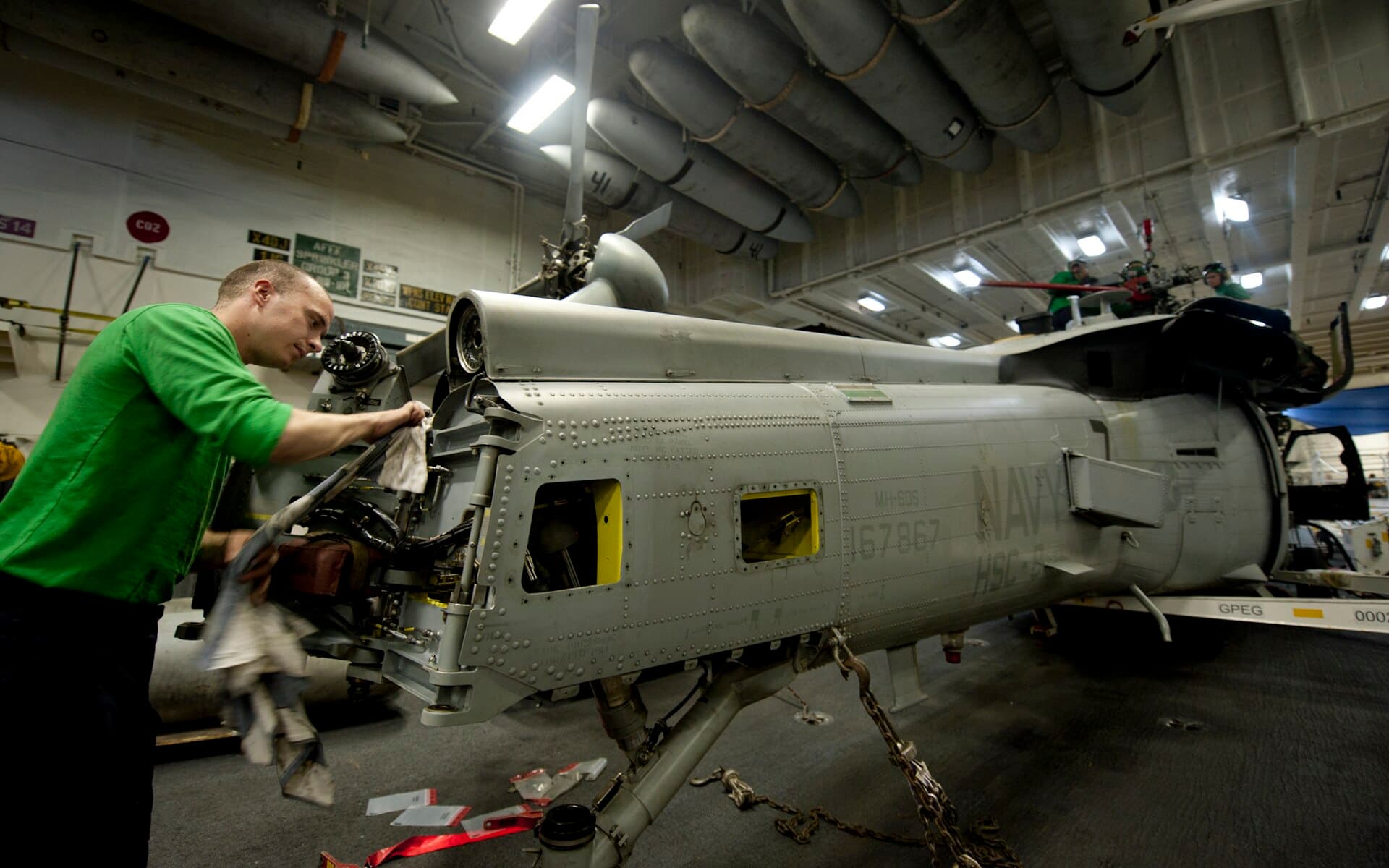 Laughlin — US Navy 111228-N-OY799-058 Aviation Electronics Technician 3rd Class Stephen Hesch, from Laughlin, Nev., cleans grease off the tail rotor on an MH